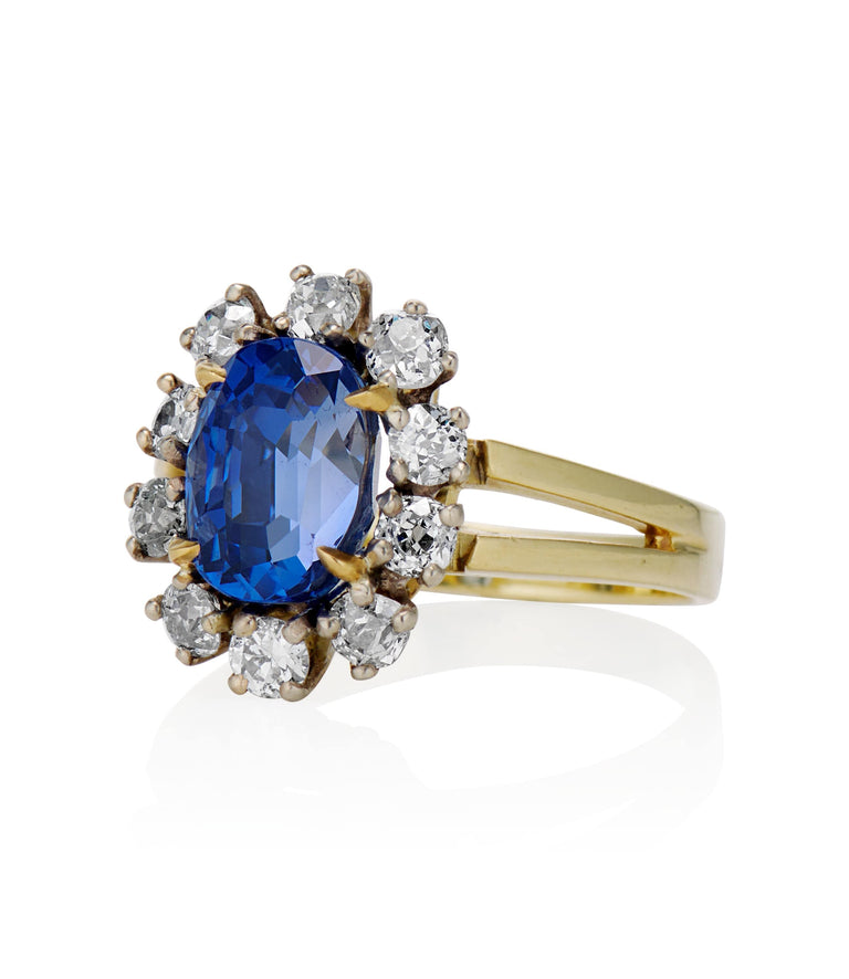 Midcentury 3.22 Carat Oval Step Cut Sri Lanka No Heat Sapphire and Diamond Two Tone Gold Cluster Engagement Ring