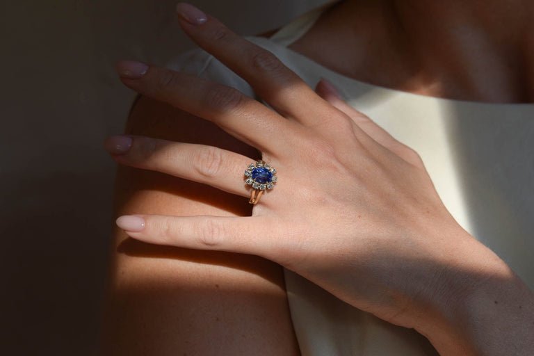 Midcentury 3.22 Carat Oval Step Cut Sri Lanka No Heat Sapphire and Diamond Two Tone Gold Cluster Engagement Ring