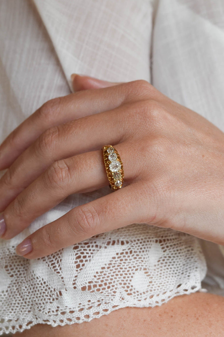 Belle Époque 1.40 Carat Old Mine Cut Diamond Yellow Gold Antique Five Stone Carved Band